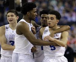 Four thin young Dukes: Grayson Allen's adorable face, Justise Winslow, and Tyus Jones. In the background, an actual *senior*, Quinn Cook.