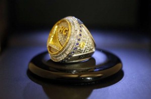 Head Coach (HC) Steve Kerr's 2015 ring, no. 6. (What does one *do* with these things? Too big, too pricey to wear.) Head Coach (HC -- players get their number) Steve Kerr's 2015 trinket, no. 6. (What to *do* with such a thing? Too big, too pricey to wear.) (Photo from San Francisco Chronicle article.)